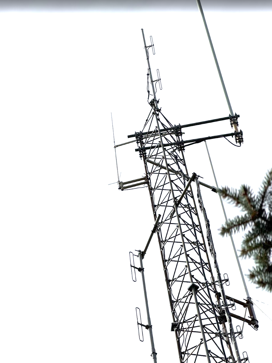 The antenna tower at the old repeater site — the club's Comet UHF antenna is visible at the top left, still mounted alongside other now-silent antennas